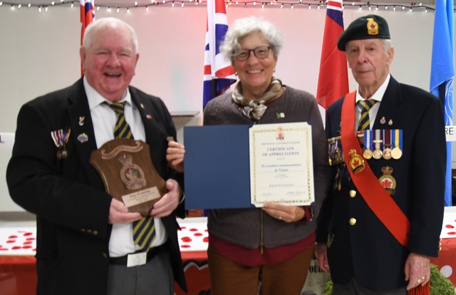 Photo of Suzanne Lépine receiving the certificate from the Royal Canadian Legion, Eastview